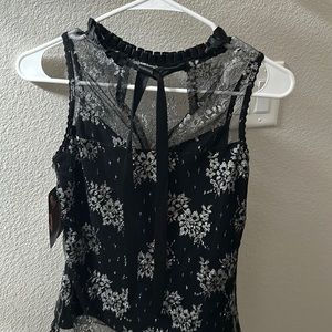 Canadian brand DONNA , size XS . Black with silver floral designs